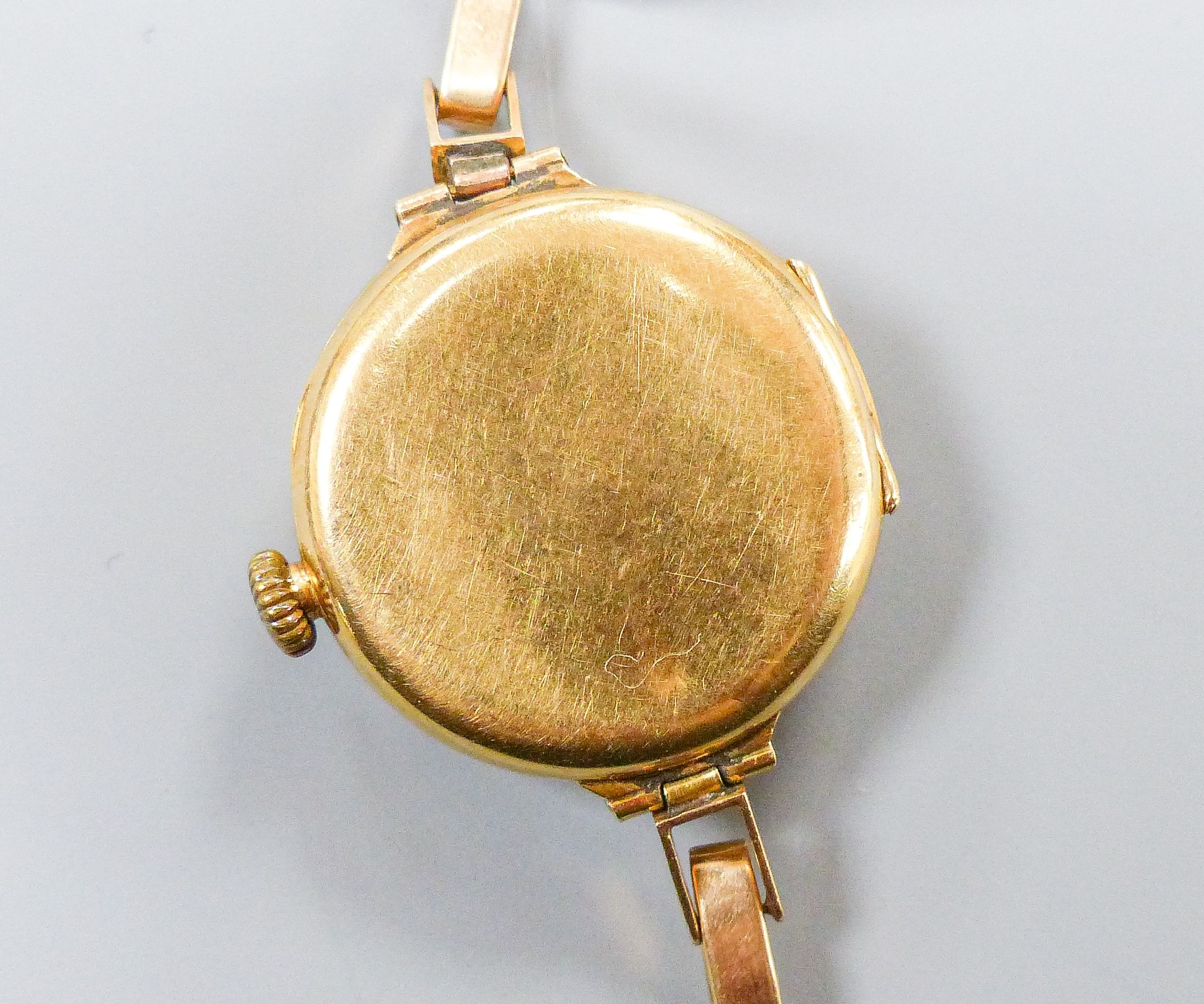 A lady's George V 18ct gold cased manual wind wrist watch, lacking bracelet, case hallmarked for Birmingham, 1917, retailed by Muir & Sons, Glasgow